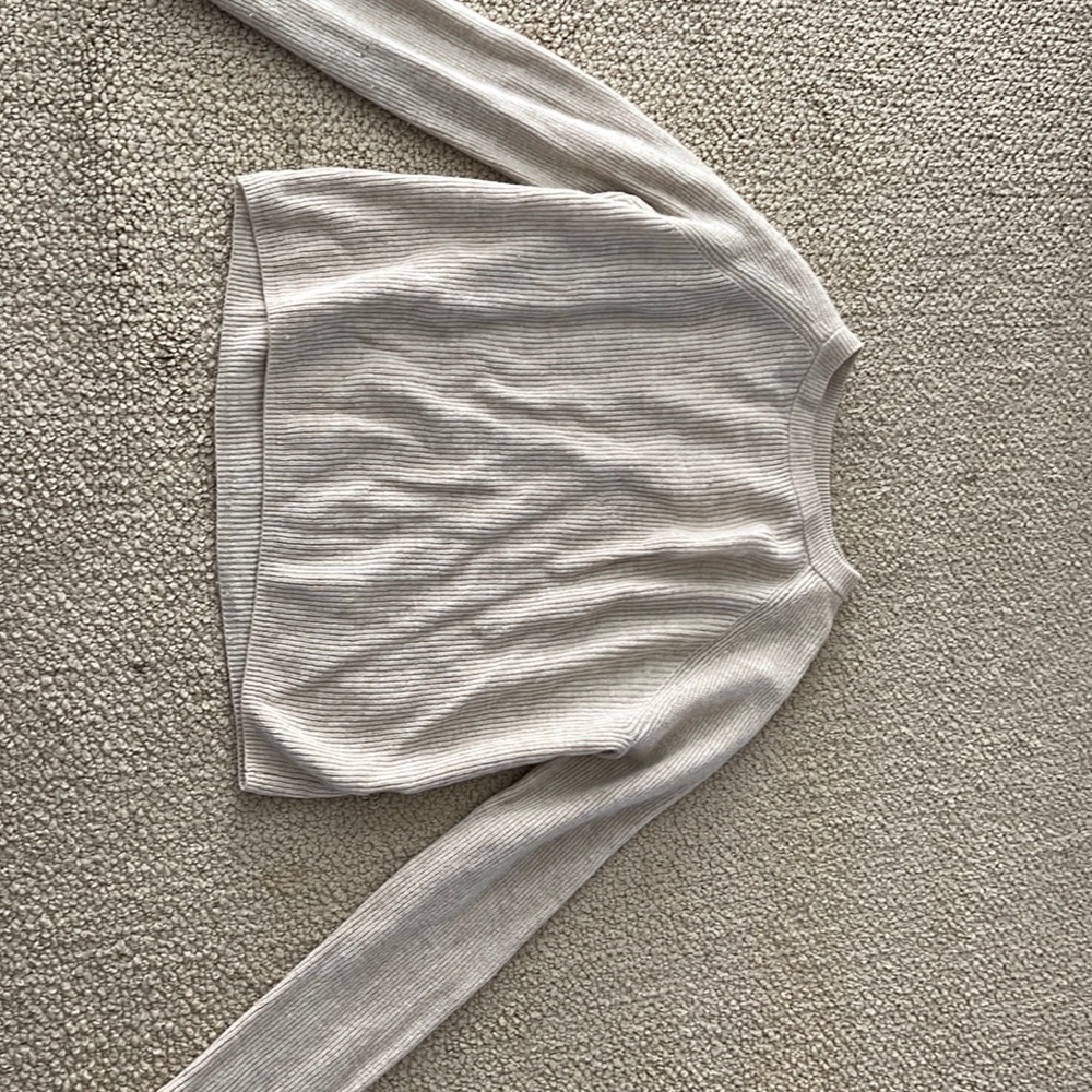 A Brandy Melville tan sweater! Super cute, comfy, and versatile!
